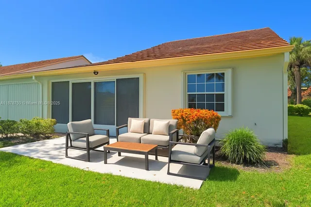 an aerial view of residential house with outdoor space and street view