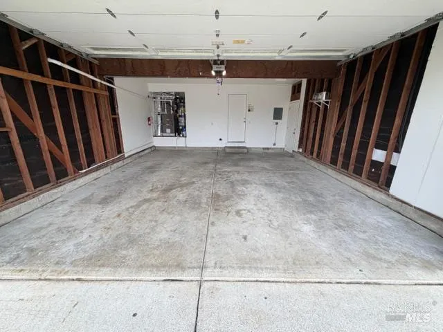 a view of a yard with a wooden fence