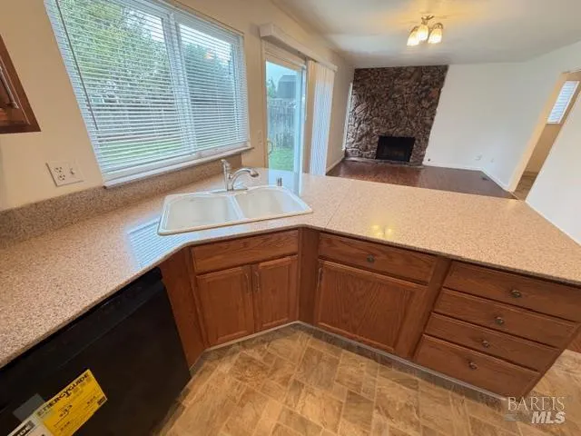 a kitchen with a sink and a mirror