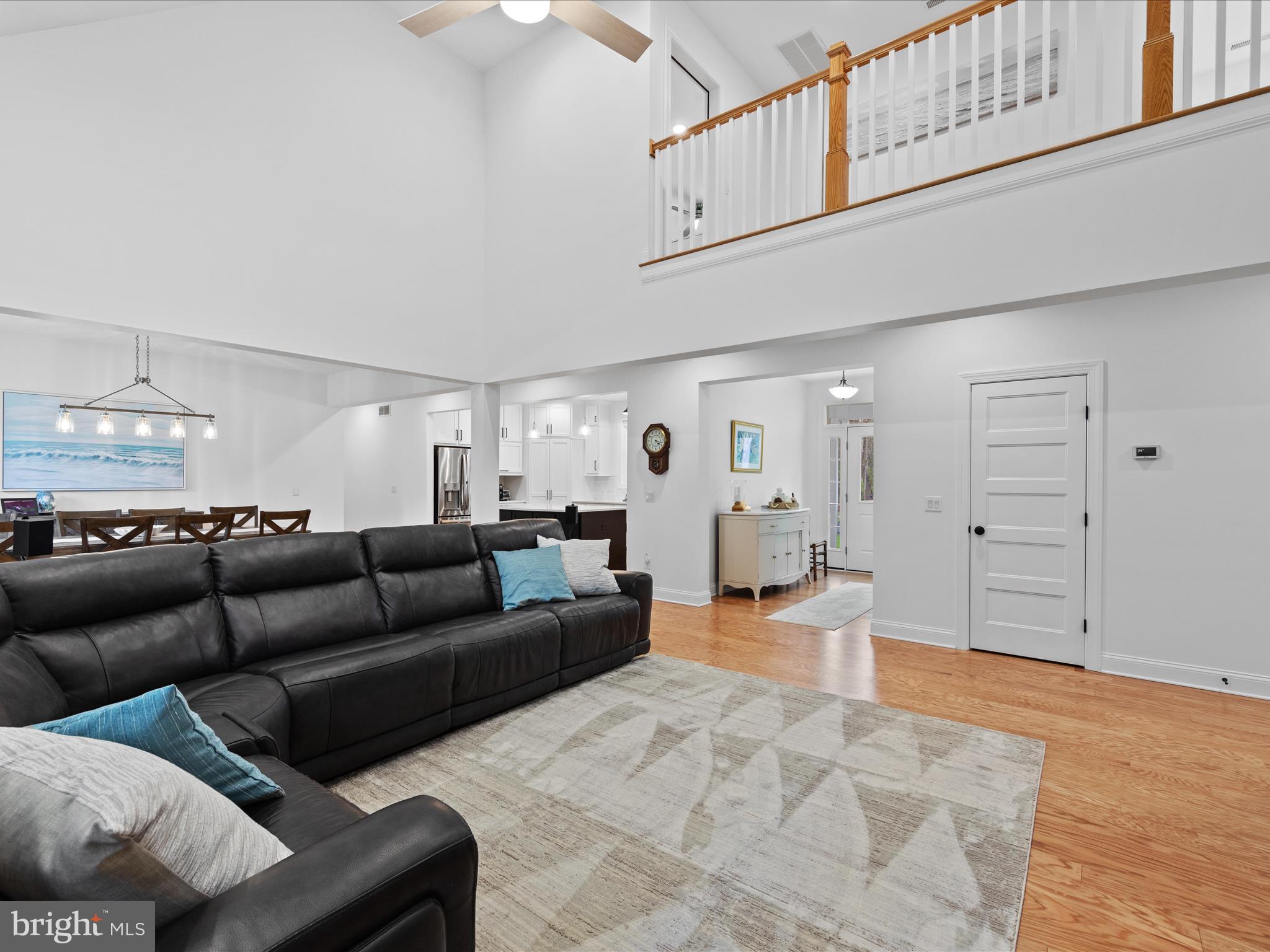 20005 Devine Way Milton, DE 19968 - Photo 16 of 82 a living room with furniture and view of kitchen