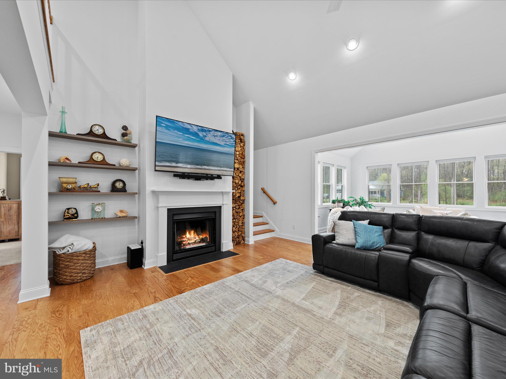 20005 Devine Way Milton, DE 19968 - Photo 18 of 82 a living room with furniture a fireplace and a large window