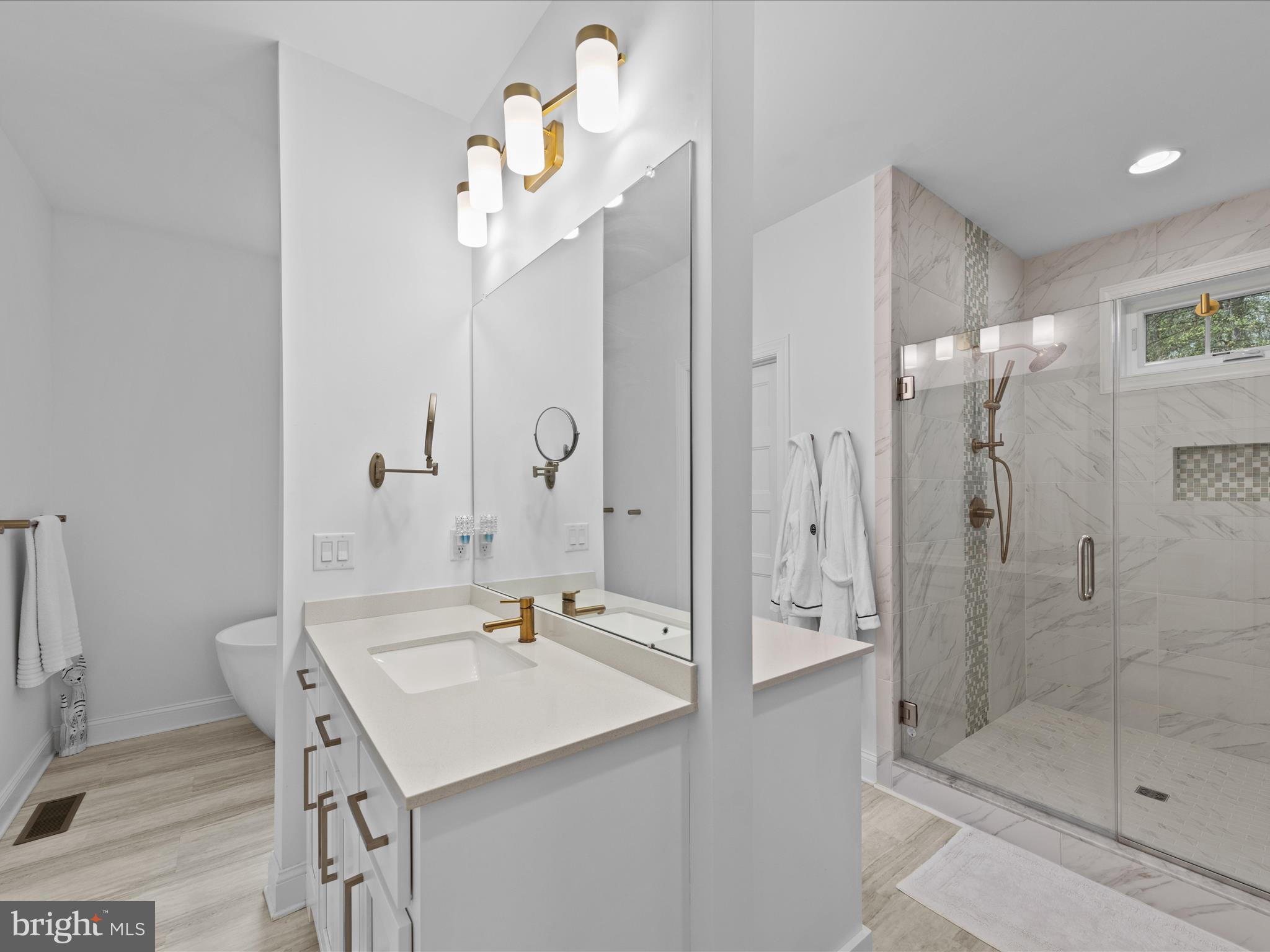 20005 Devine Way Milton, DE 19968 - Photo 25 of 82 a bathroom with a shower sink and mirror