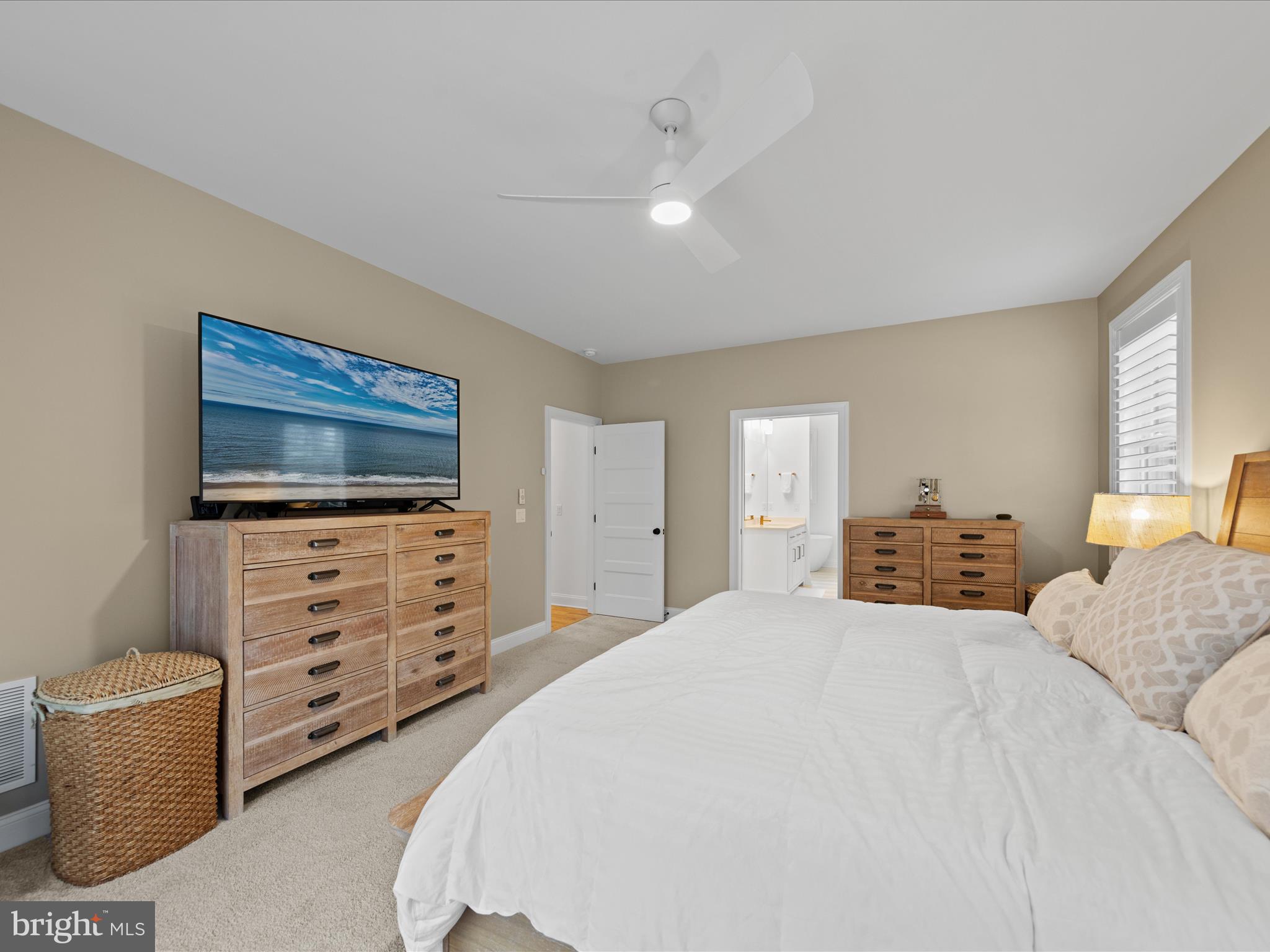 20005 Devine Way Milton, DE 19968 - Photo 32 of 82 a bedroom with a bed and a flat screen tv in it