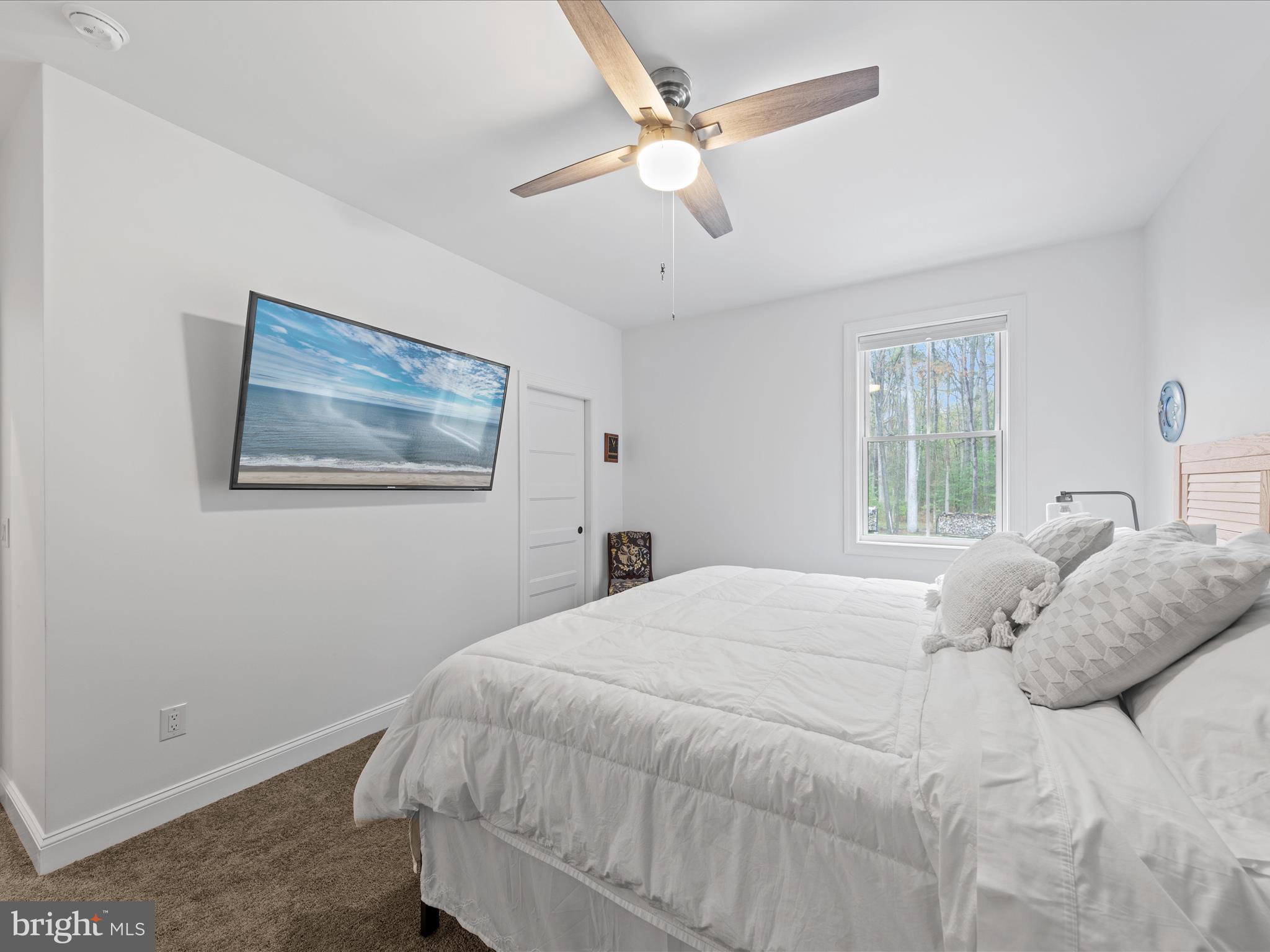 20005 Devine Way Milton, DE 19968 - Photo 36 of 82 a bedroom with a large bed and a window