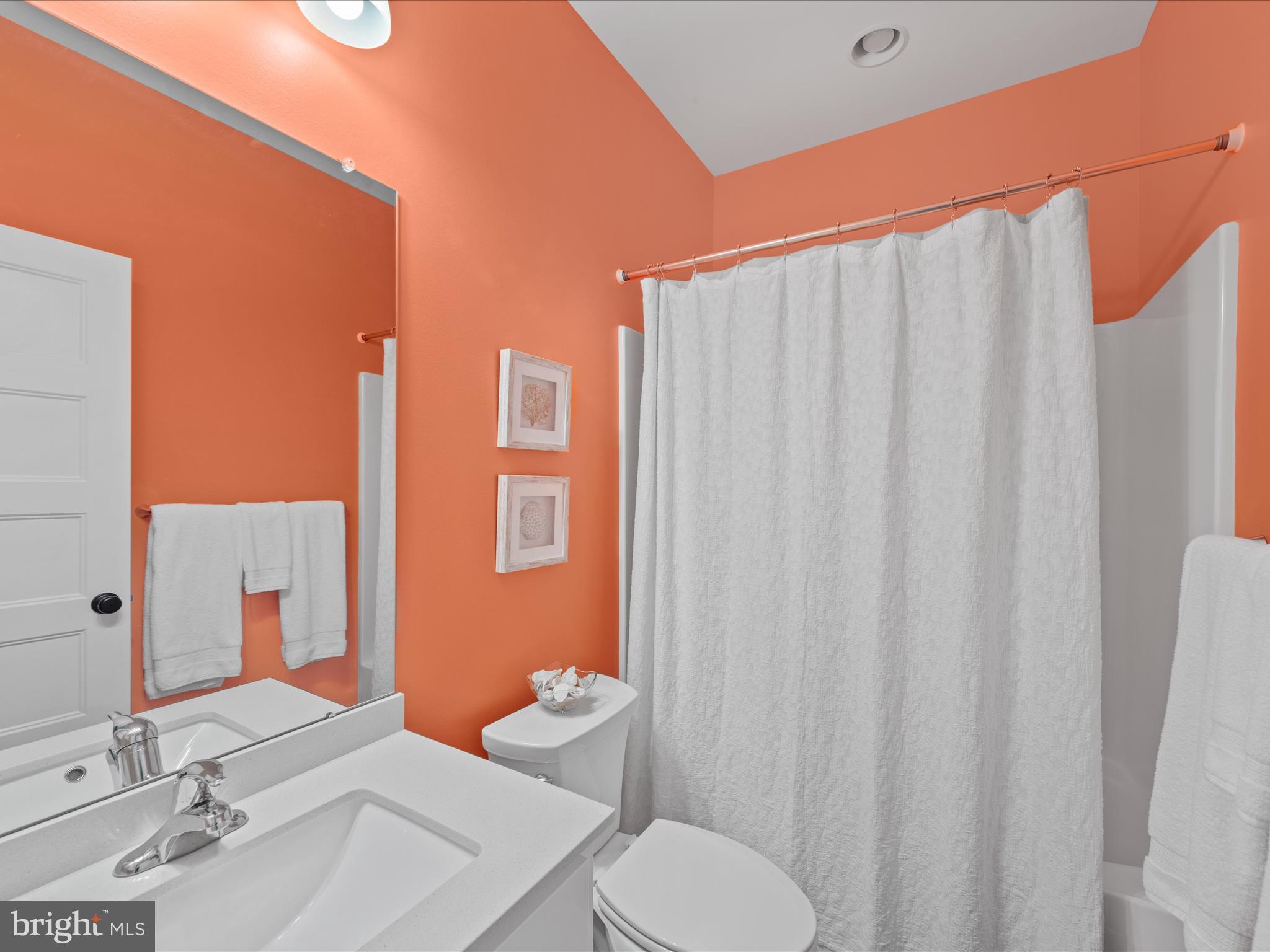 20005 Devine Way Milton, DE 19968 - Photo 41 of 82 a bathroom with a sink a toilet and shower curtain