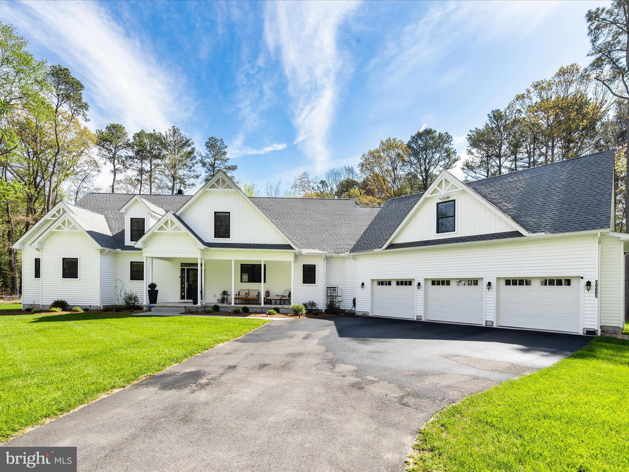 20005 Devine Way Milton, DE 19968 - Photo 65 of 82 a view of a white house with a big yard and large trees