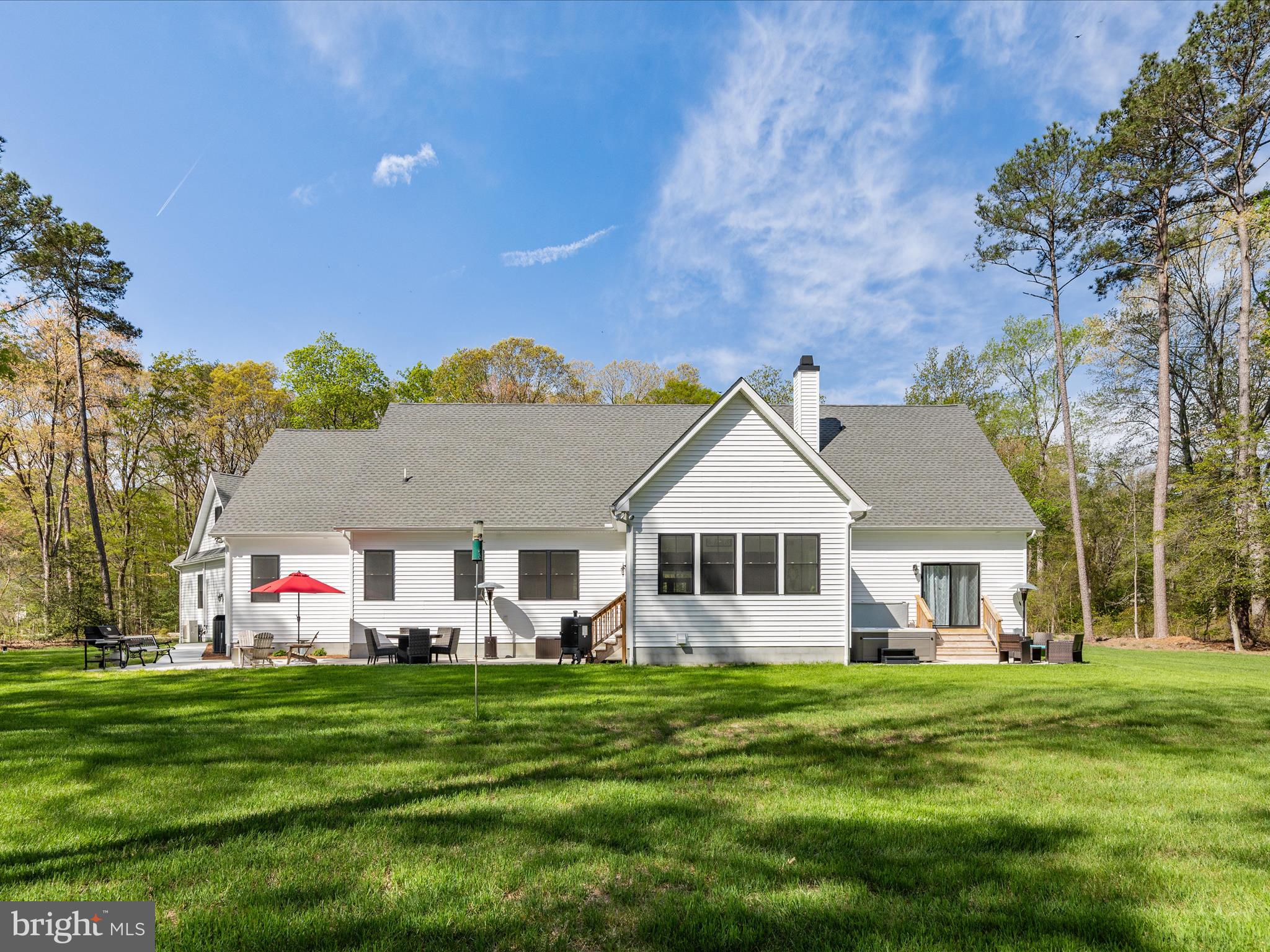 20005 Devine Way Milton, DE 19968 - Photo 73 of 82 a view of a house with a backyard and a patio