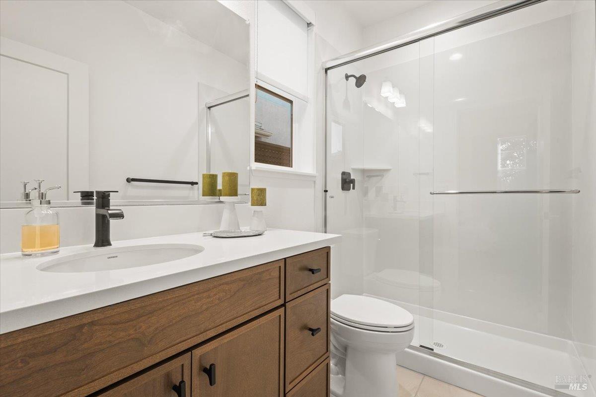 1469 Oak Circle Rohnert Park, CA 94928 - Photo 32 of 42 Private Guest Suite Convenience A full bathroom adjacent to the downstairs bedroom provides flexibility and privacy for overnight guests or long-term accommodations.