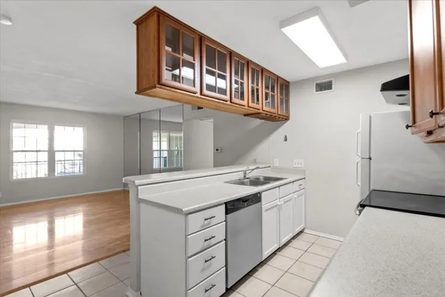 a kitchen with a stove and a cabinet