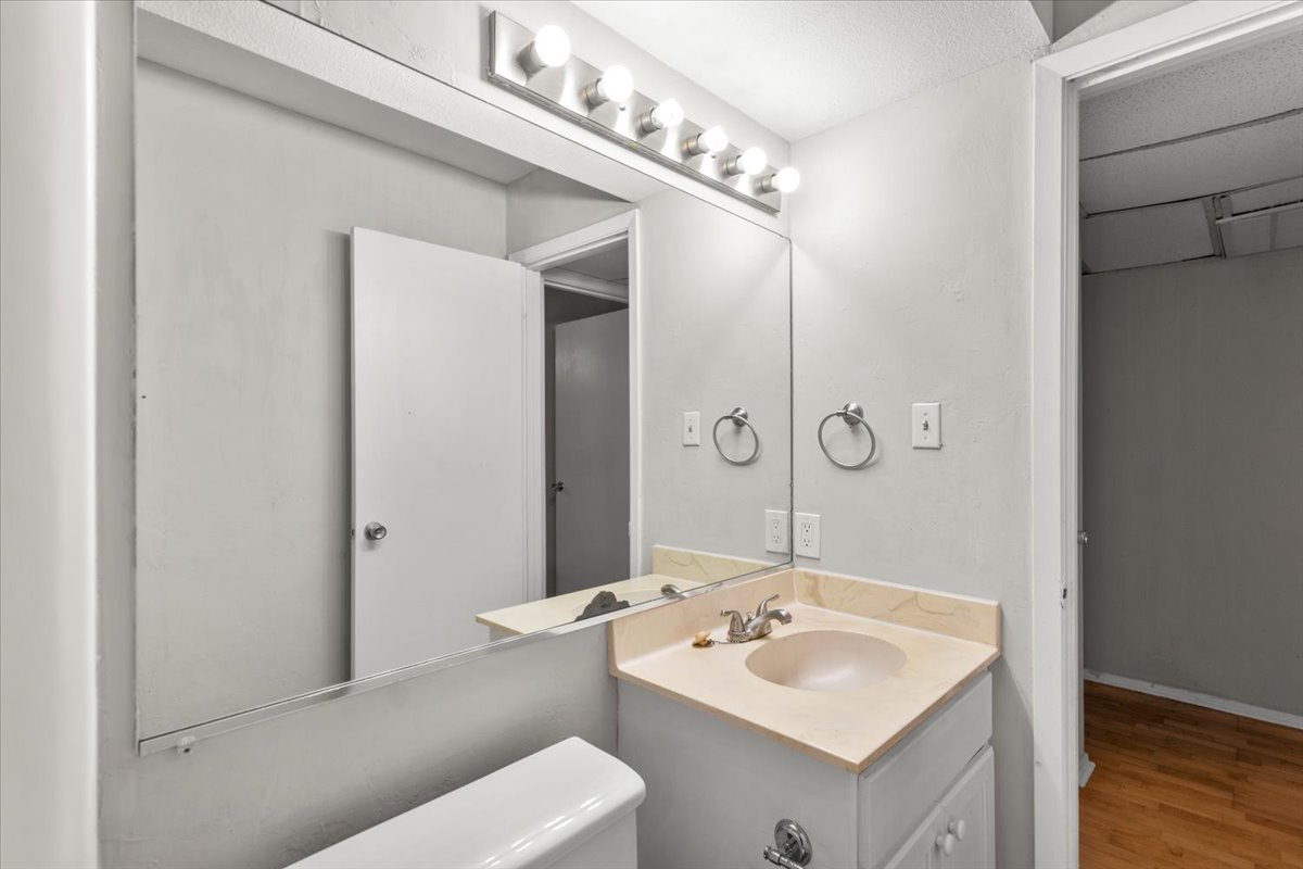 910 Duncan Lane, Unit 57 Austin, TX 78705 - Photo 28 of 34 a bathroom with a sink and a mirror