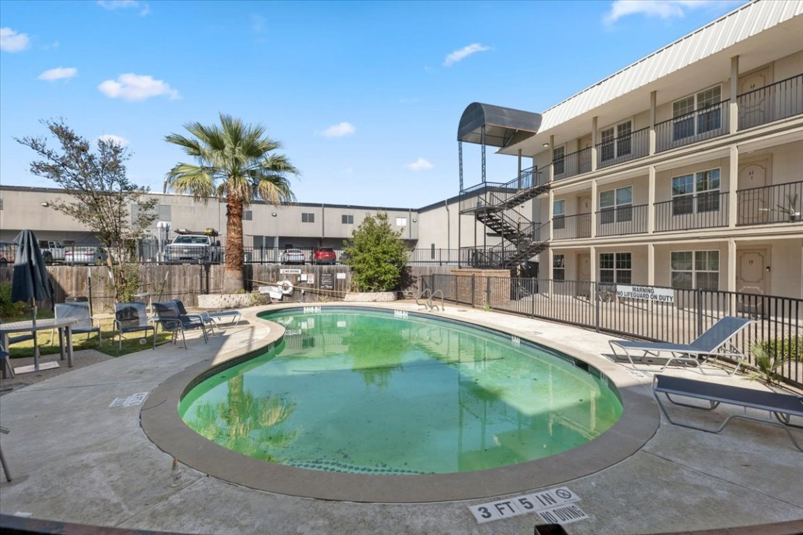 910 Duncan Lane, Unit 57 Austin, TX 78705 - Photo 29 of 34 a swimming pool with outdoor seating yard and barbeque oven