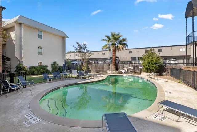 a view of a house with backyard and porch