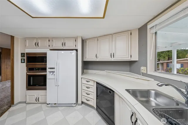 a workspace with a couch and a window