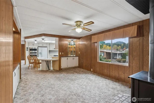 a living room with furniture and chandelier