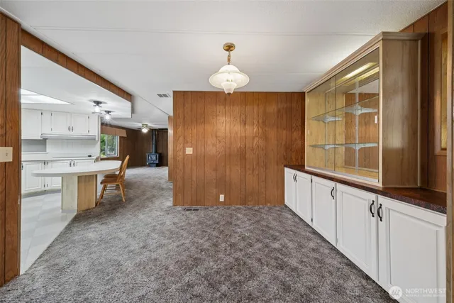 a view of a hallway with windows