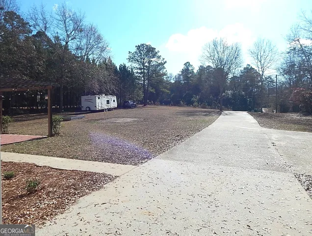 a view of a yard with a tree
