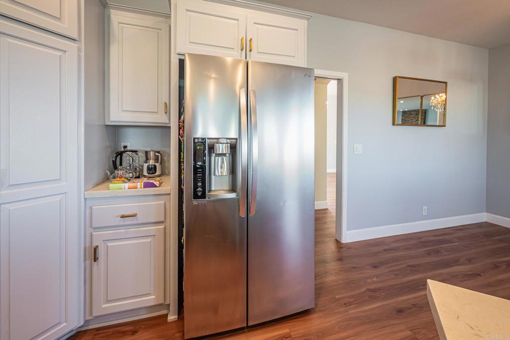 30606 Falling Star Circle Valley Center, CA 92082 - Photo 36 of 70 a kitchen with stainless steel appliances granite countertop a refrigerator and a refrigerator
