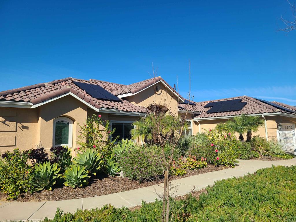 30606 Falling Star Circle Valley Center, CA 92082 - Photo 69 of 70 a front view of a house with a garden