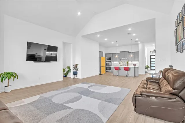 a room with furniture and a flat screen tv