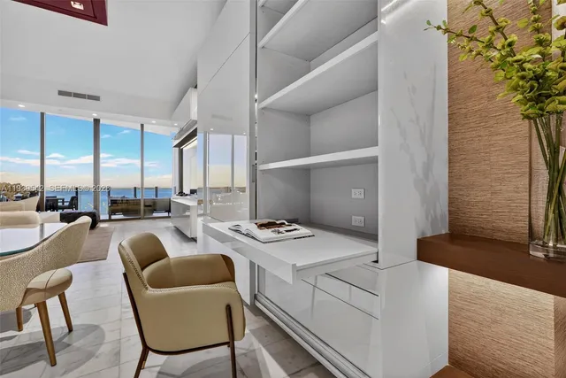 a bedroom with a large bed and a large window