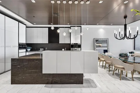 a kitchen with a sink cabinets and window