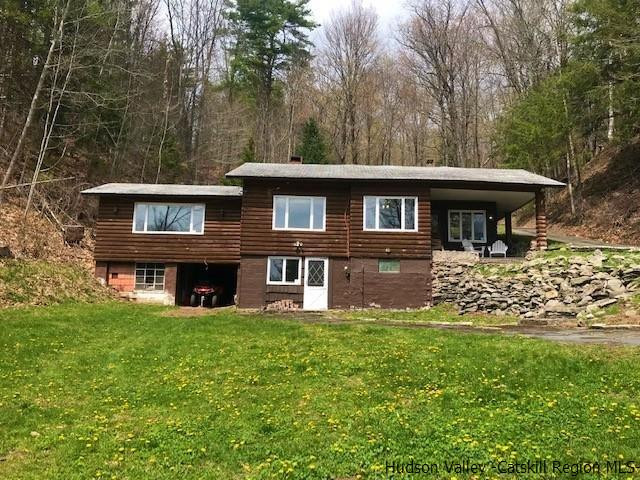 102 Valenti Road Gilboa, NY 12076 - Photo 1 of 32 a front view of a house with garden