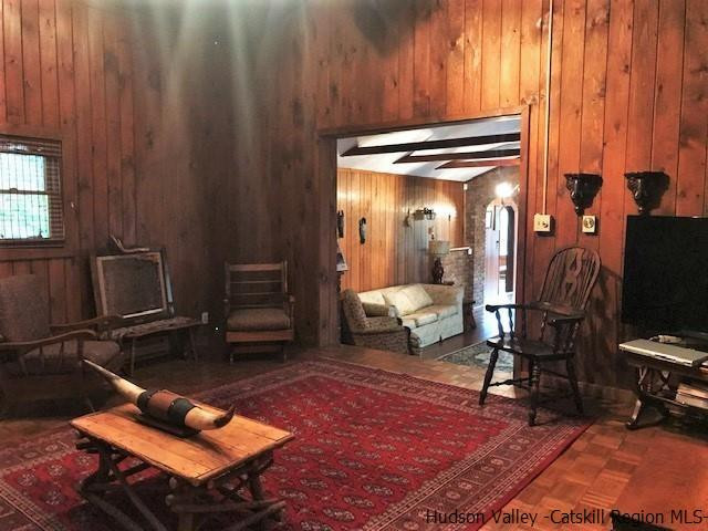 102 Valenti Road Gilboa, NY 12076 - Photo 17 of 32 a living room with furniture a rug and a window