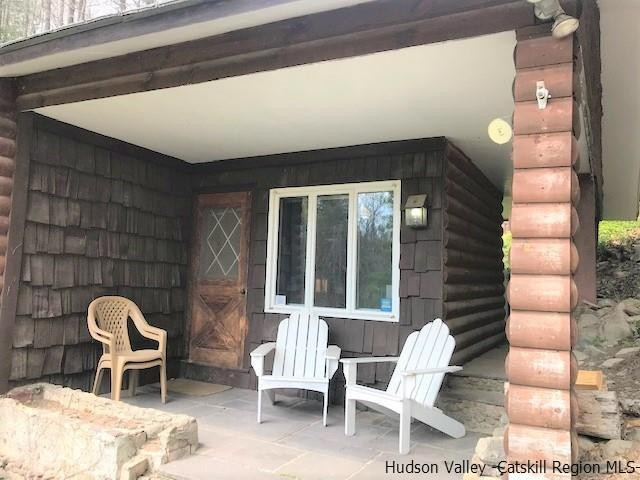 102 Valenti Road Gilboa, NY 12076 - Photo 28 of 32 a front view of a house with outdoor seating