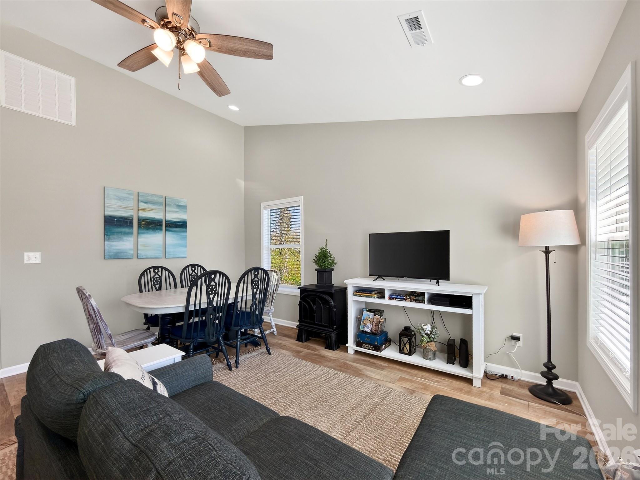 116 Bostic Street Marion, NC 28752 - Photo 11 of 28 a living room with furniture a fireplace and a flat screen tv