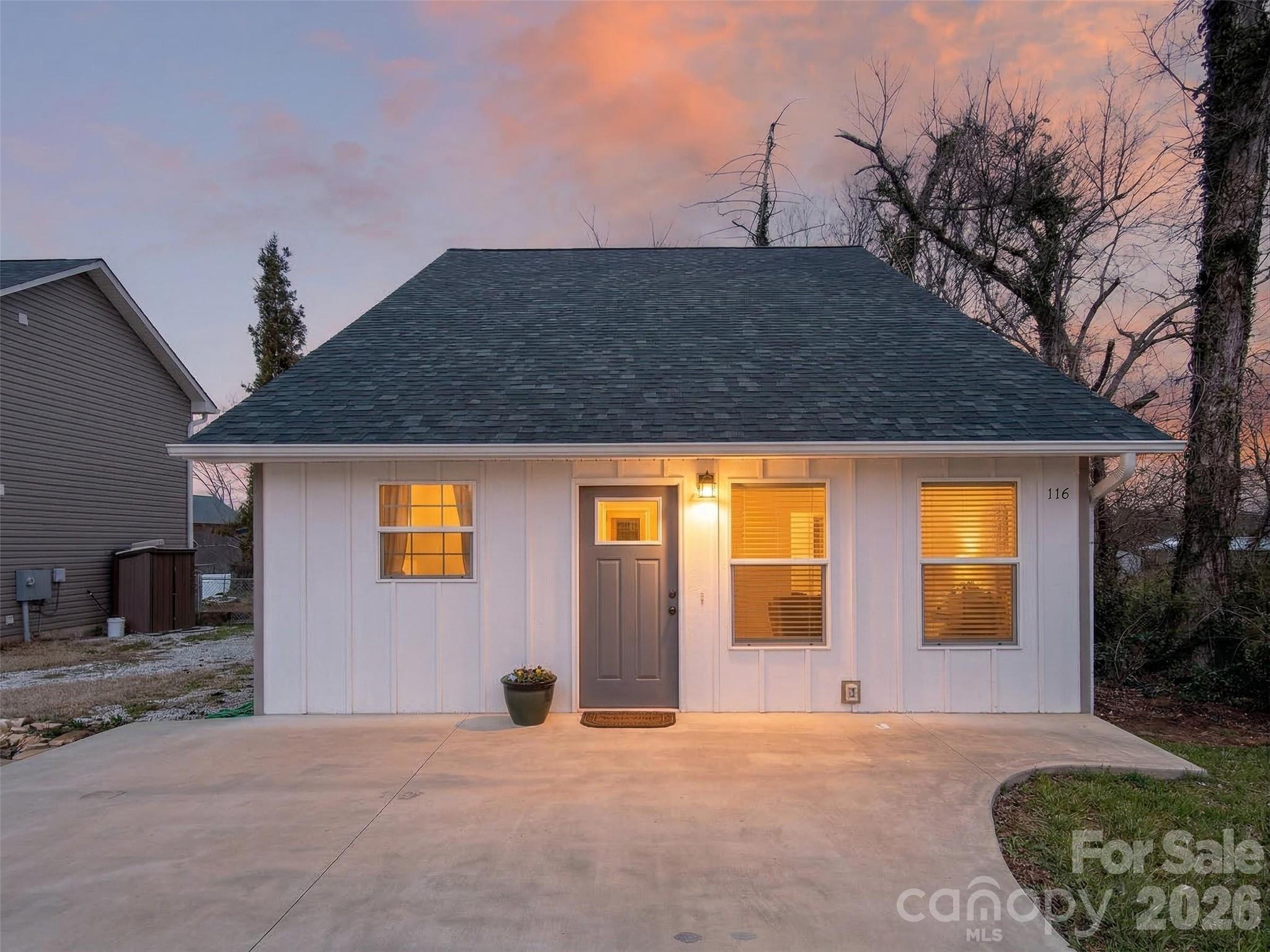 116 Bostic Street Marion, NC 28752 - Photo 2 of 28 a view of a house with backyard and a tree