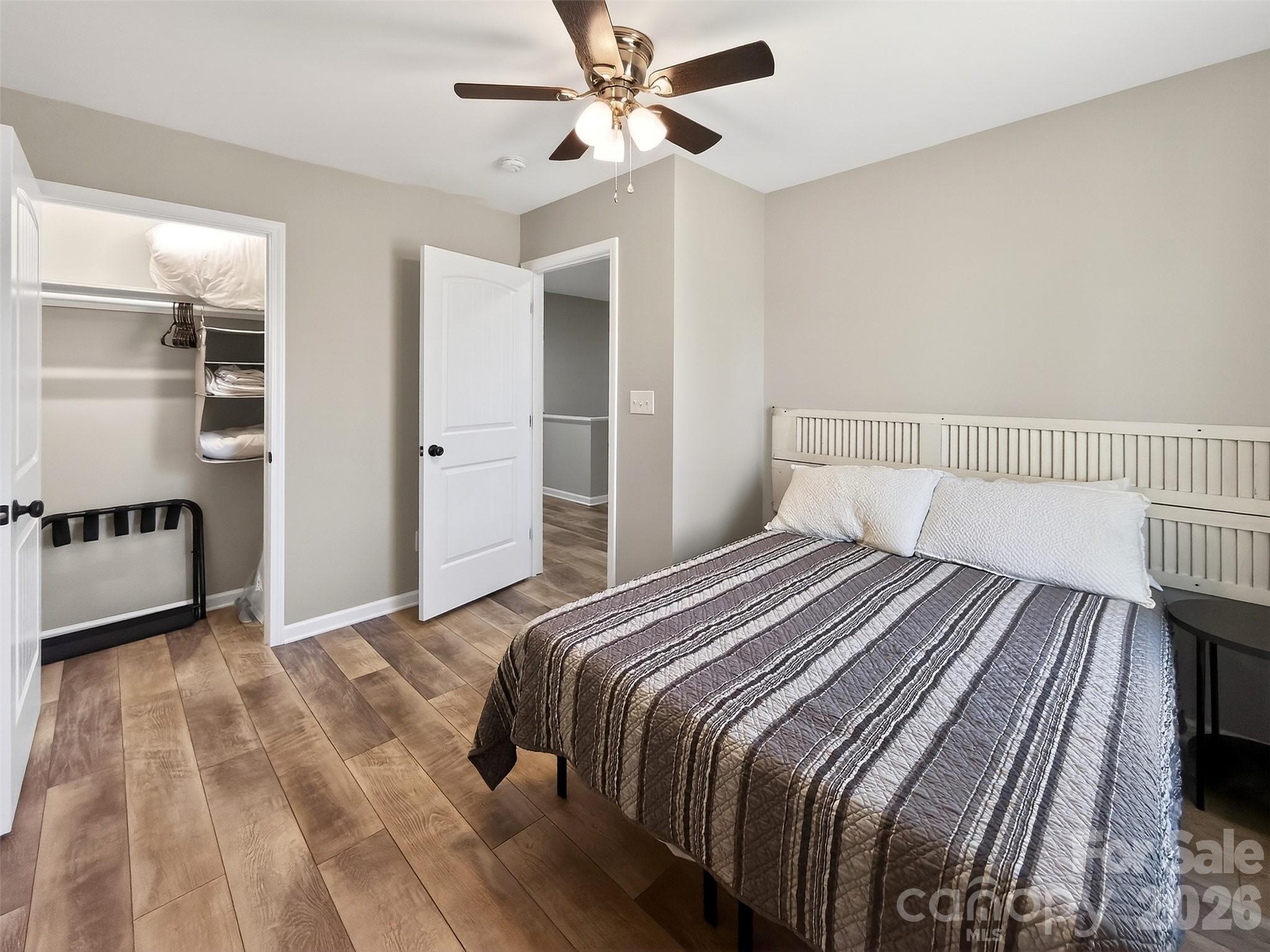 116 Bostic Street Marion, NC 28752 - Photo 24 of 28 a bedroom with a bed and a walk in closet