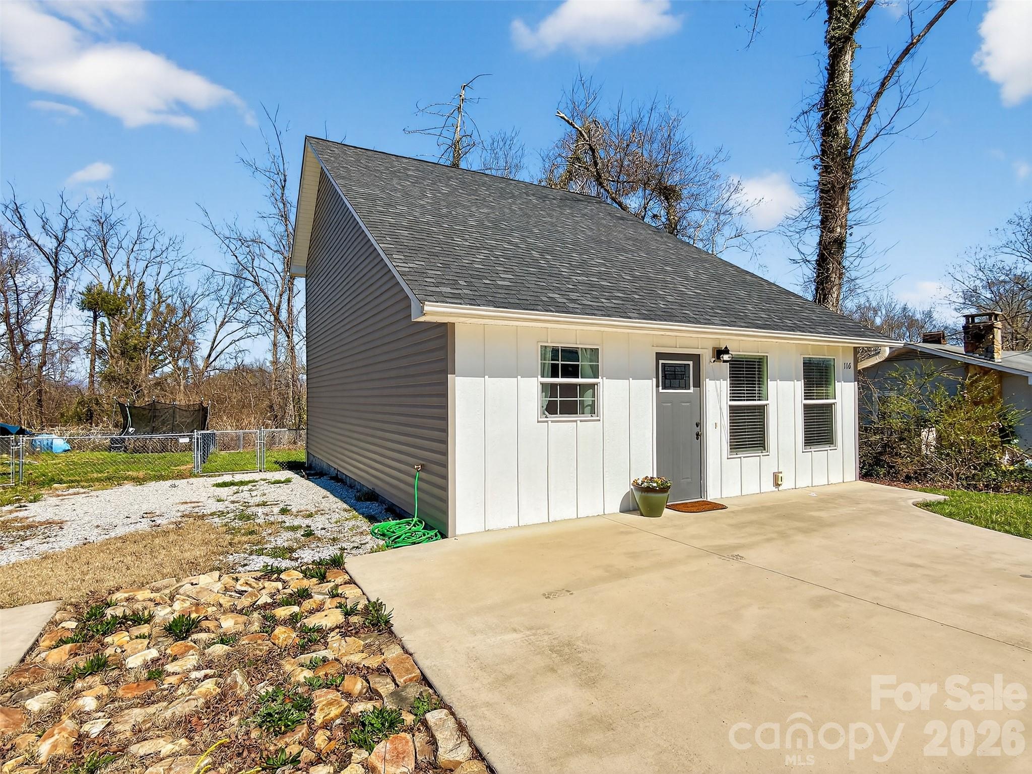 116 Bostic Street Marion, NC 28752 - Photo 4 of 28 a front view of a house with a yard