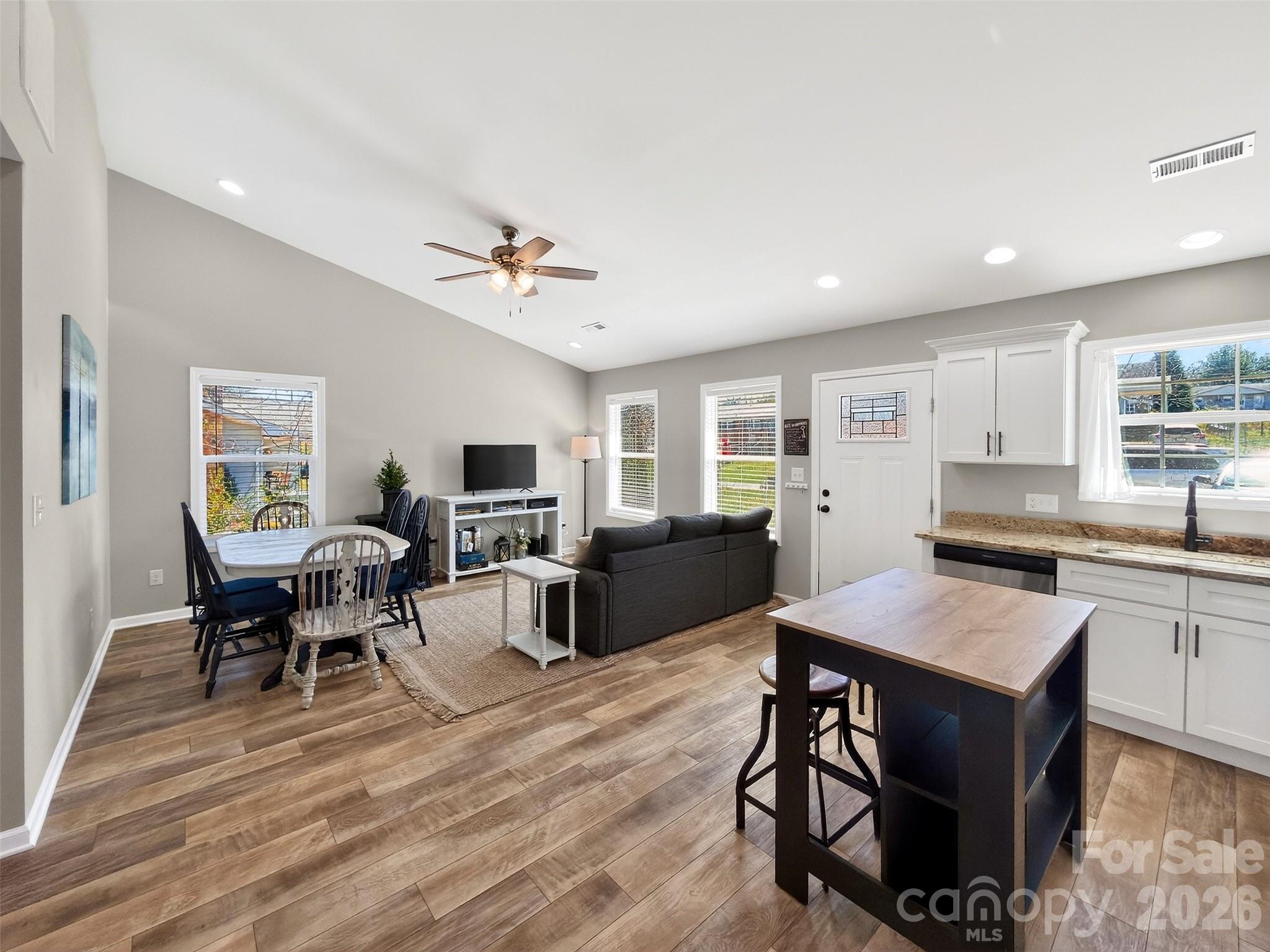 116 Bostic Street Marion, NC 28752 - Photo 9 of 28 a living room with furniture a flat screen tv and kitchen view
