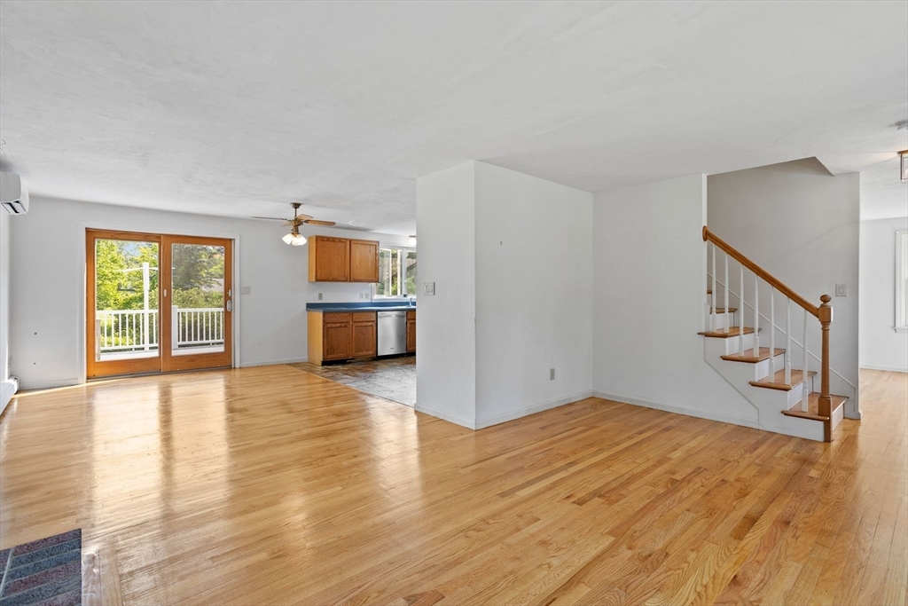 10 Farm Road Stow, MA 01775 - Photo 13 of 37 a view of empty room with wooden floor and windows