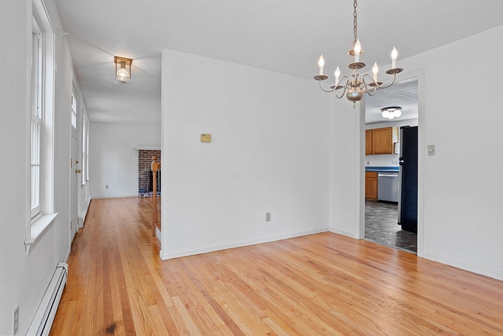 10 Farm Road Stow, MA 01775 - Photo 14 of 37 a view of a room with wooden floor and staircase