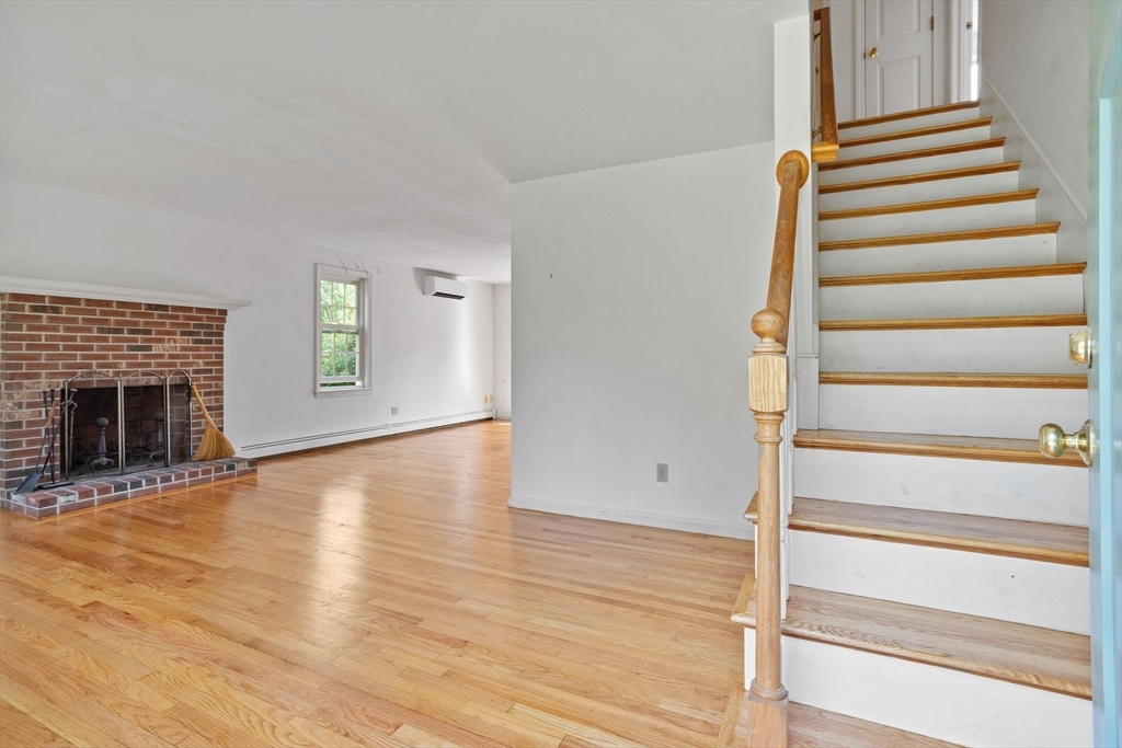 10 Farm Road Stow, MA 01775 - Photo 18 of 37 a view of an entryway with wooden floor and windows