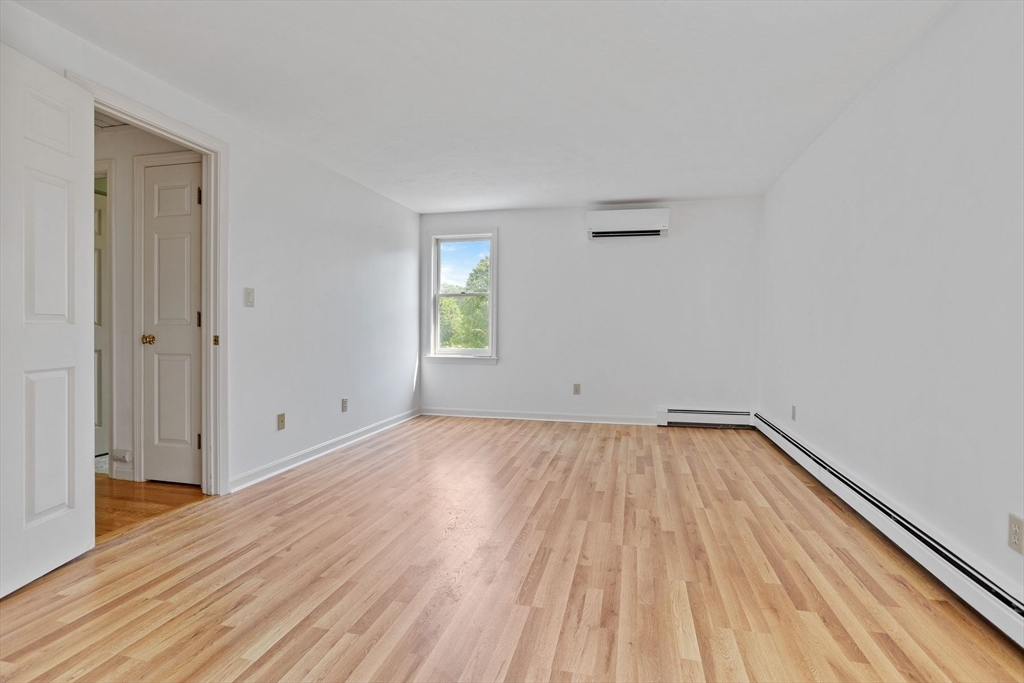 10 Farm Road Stow, MA 01775 - Photo 19 of 37 a view of a room with wooden floor and window