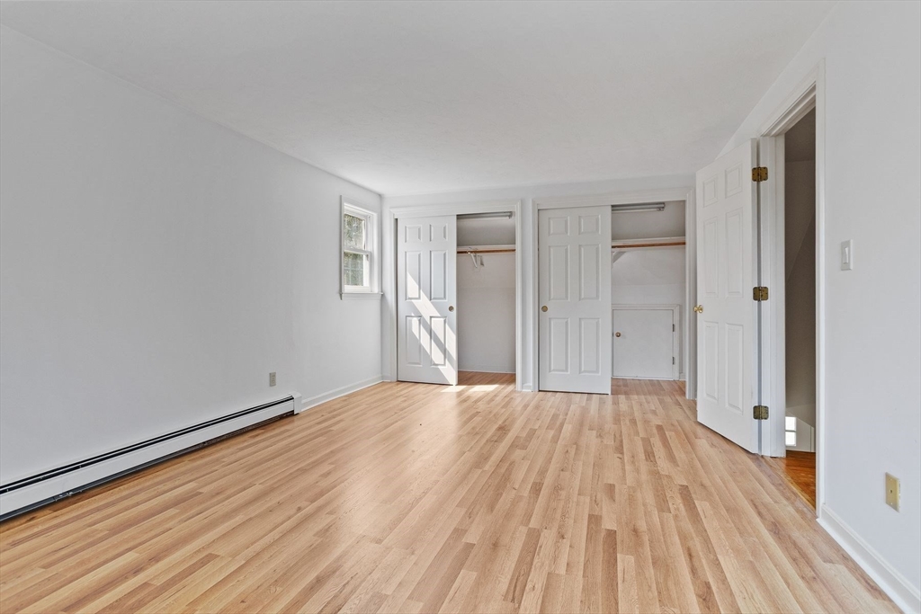 10 Farm Road Stow, MA 01775 - Photo 20 of 37 a big room with wooden floor and bathroom view