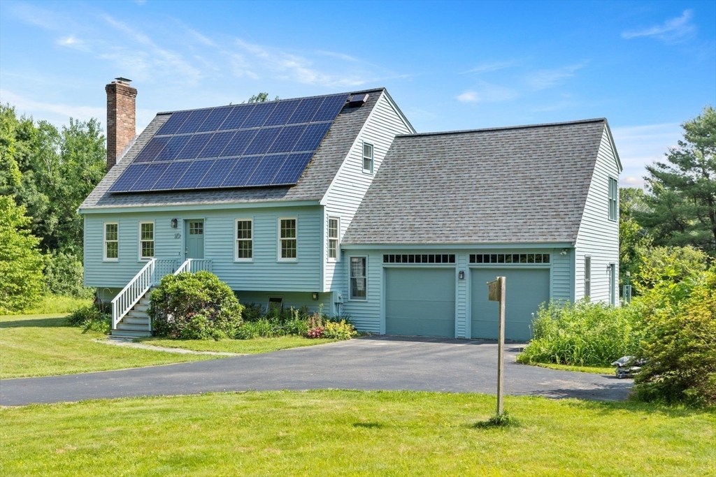 10 Farm Road Stow, MA 01775 - Photo 36 of 37 a front view of a house with a yard