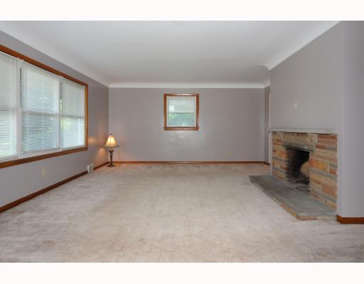1145 Pentland Avenue Rochester, PA 15074 - Photo 2 of 18 Living Room. 20 x 15 Livingroom w/New windows, hardwood under carpet & stone wood burning fireplace
