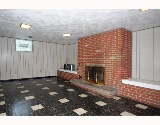 1145 Pentland Avenue Rochester, PA 15074 - Photo 7 of 18 Den/Family/Great Room. 26 x 15 Lower level familyroom with Brick wood burning fireplace and bar area