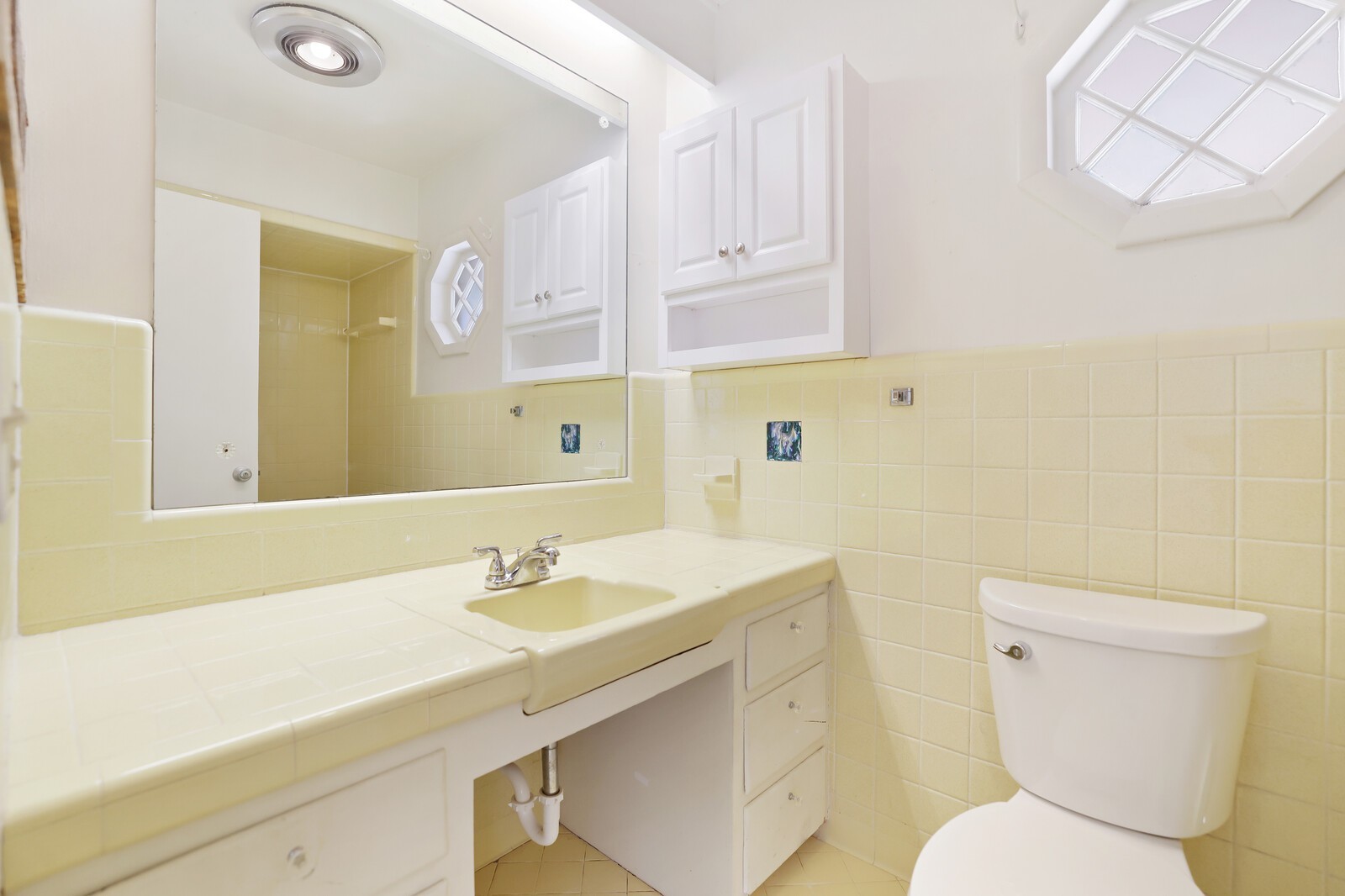 676 Ferguson Hill Road Lafayette, TN 37083 - Photo 30 of 89 a bathroom with a sink a toilet and mirror