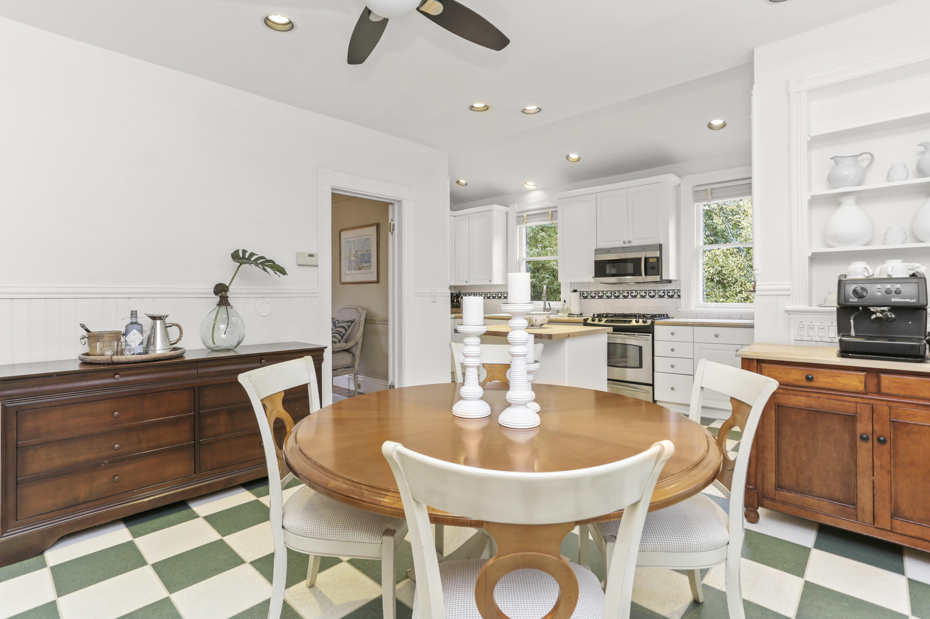 6 Park Lane Darien, CT 06820 - Photo 12 of 34 a kitchen with a dining table and chairs