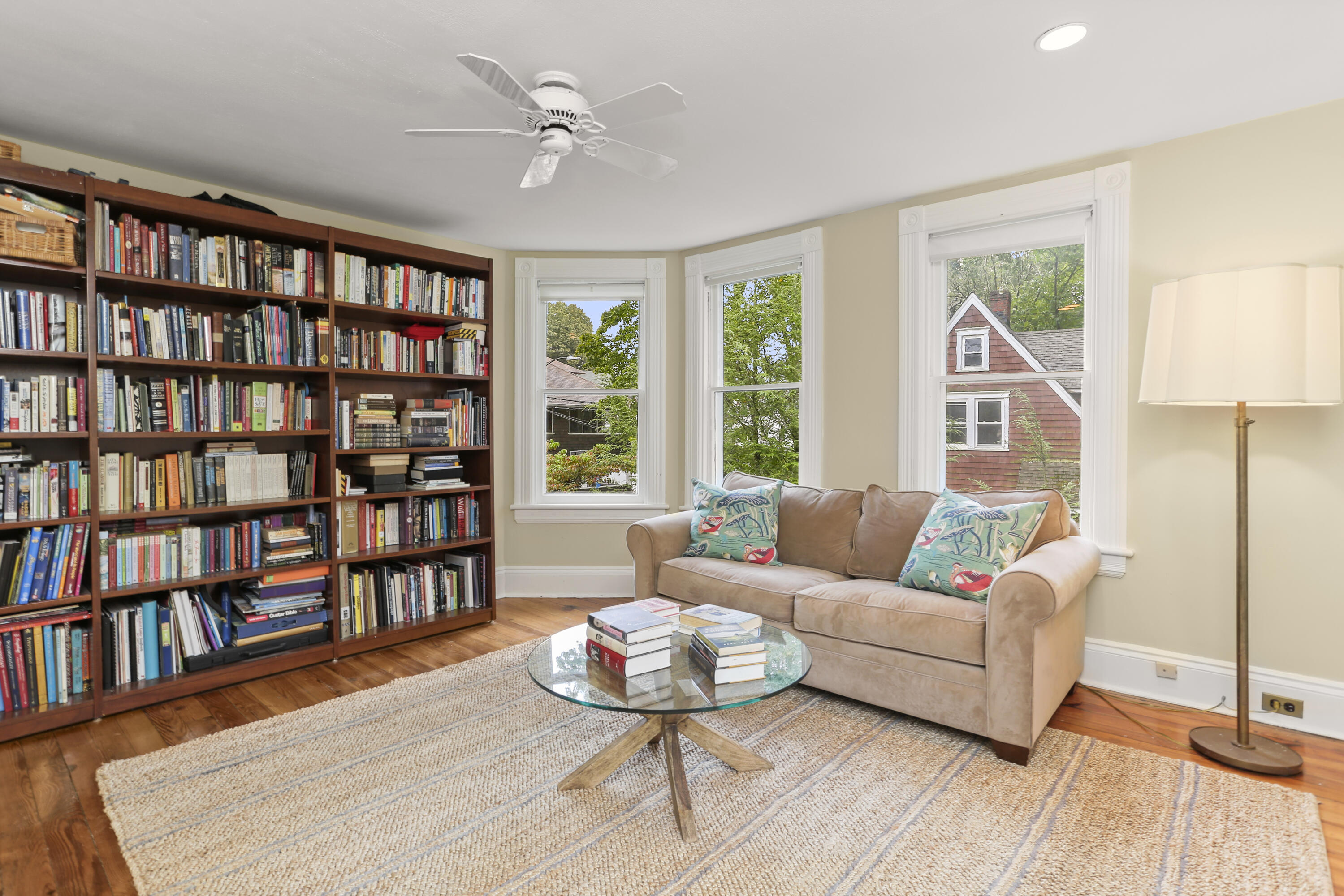 6 Park Lane Darien, CT 06820 - Photo 18 of 34 a living room with furniture and a book shelf