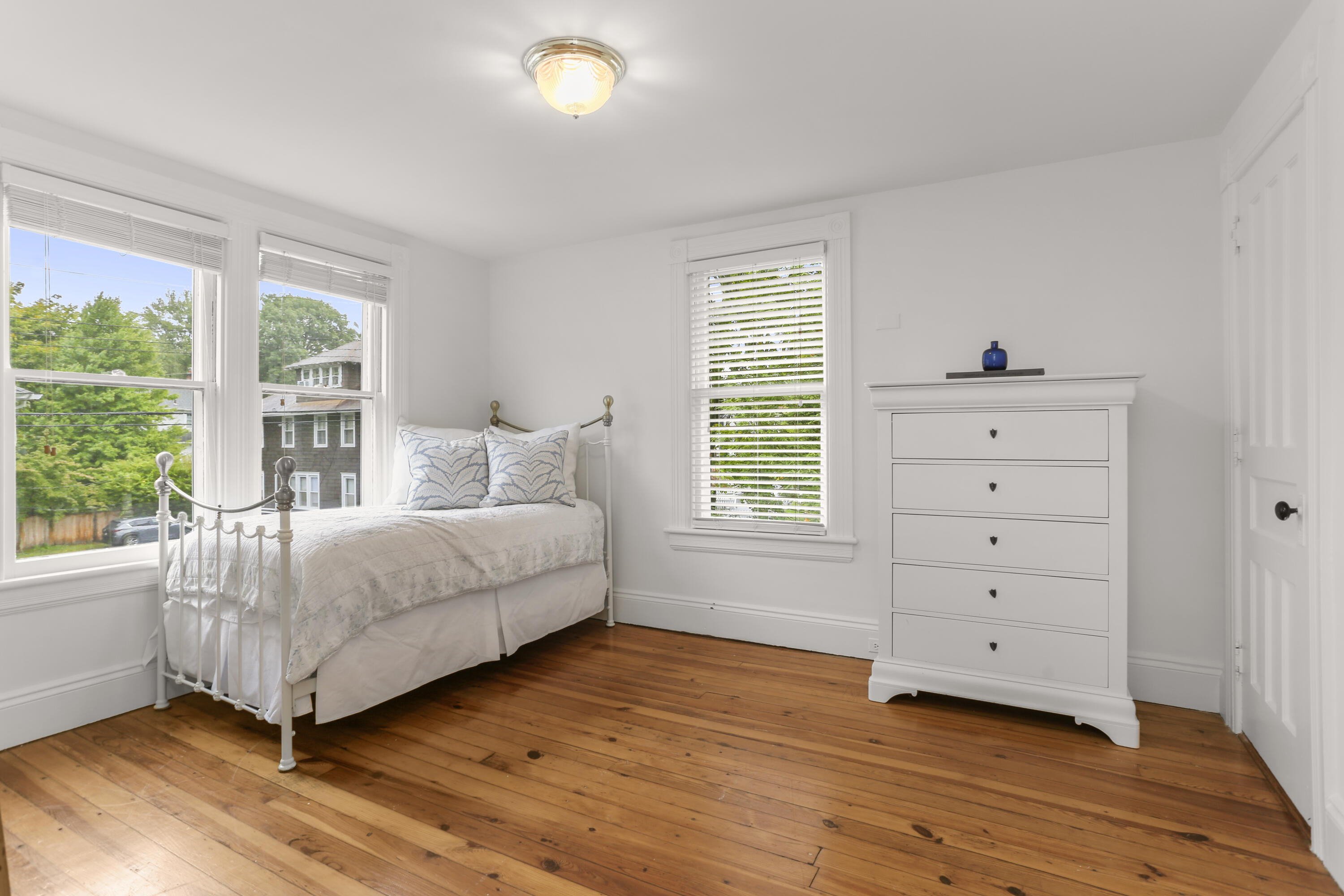 6 Park Lane Darien, CT 06820 - Photo 19 of 34 a spacious bedroom with a bed and a window