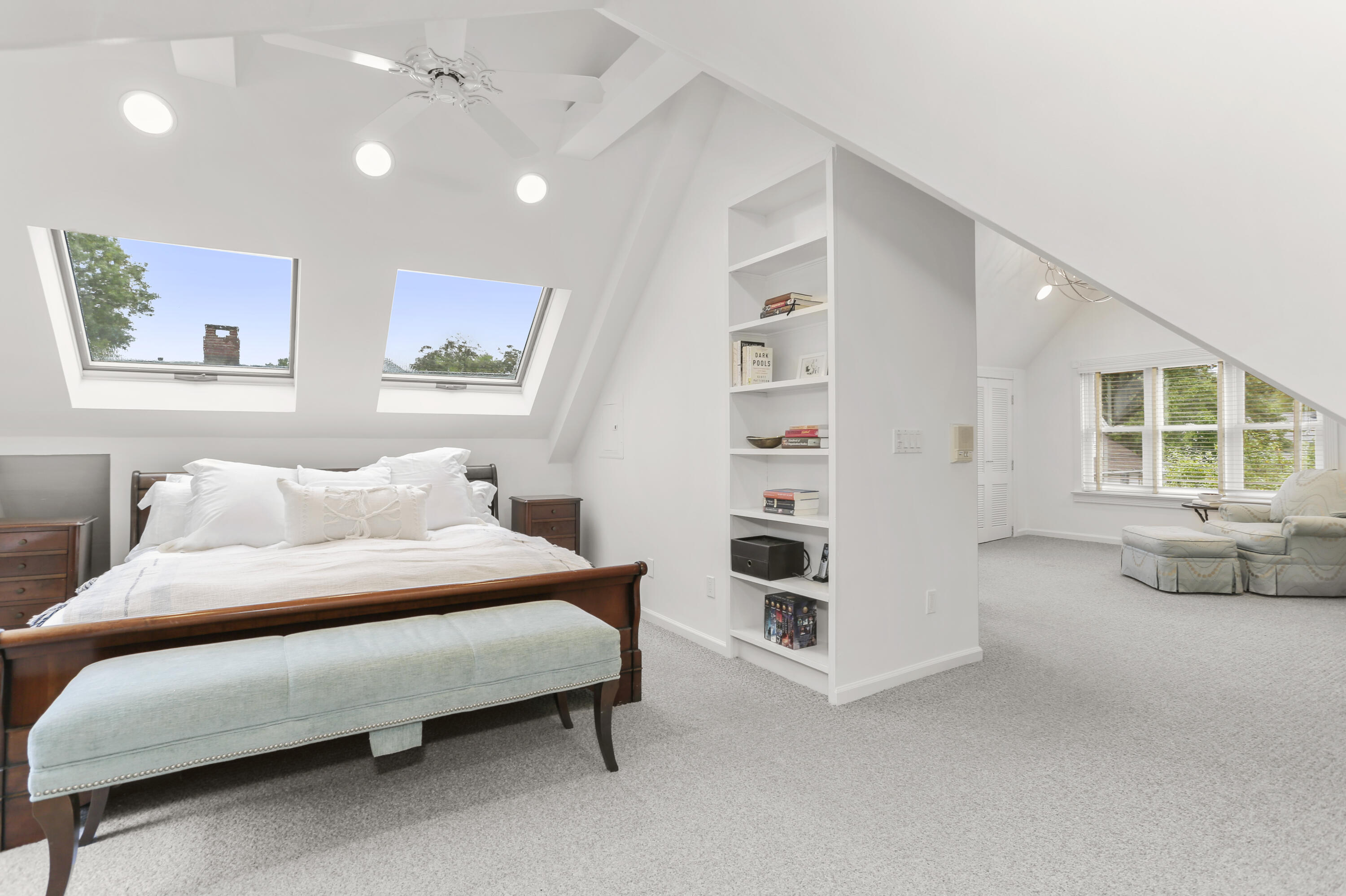 6 Park Lane Darien, CT 06820 - Photo 23 of 34 a spacious bedroom with a bed and a couch