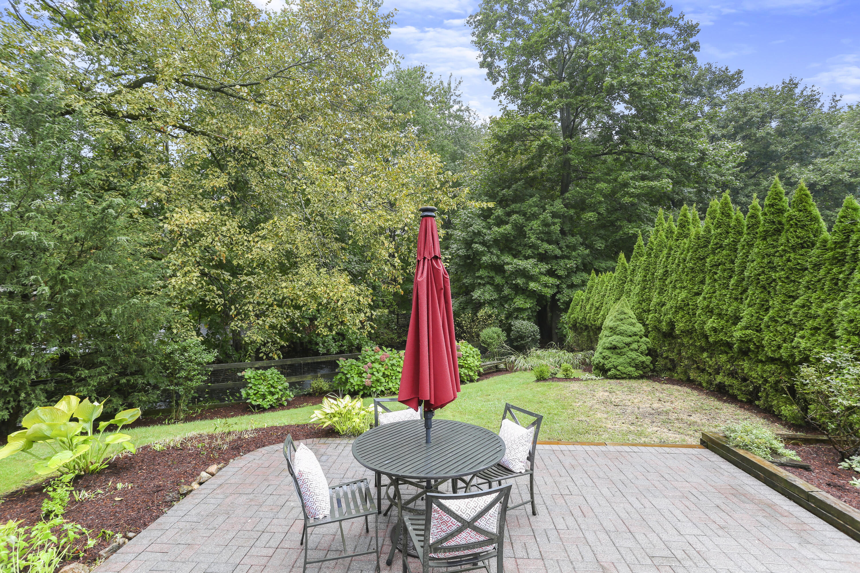 6 Park Lane Darien, CT 06820 - Photo 29 of 34 a table and chairs with wooden fence