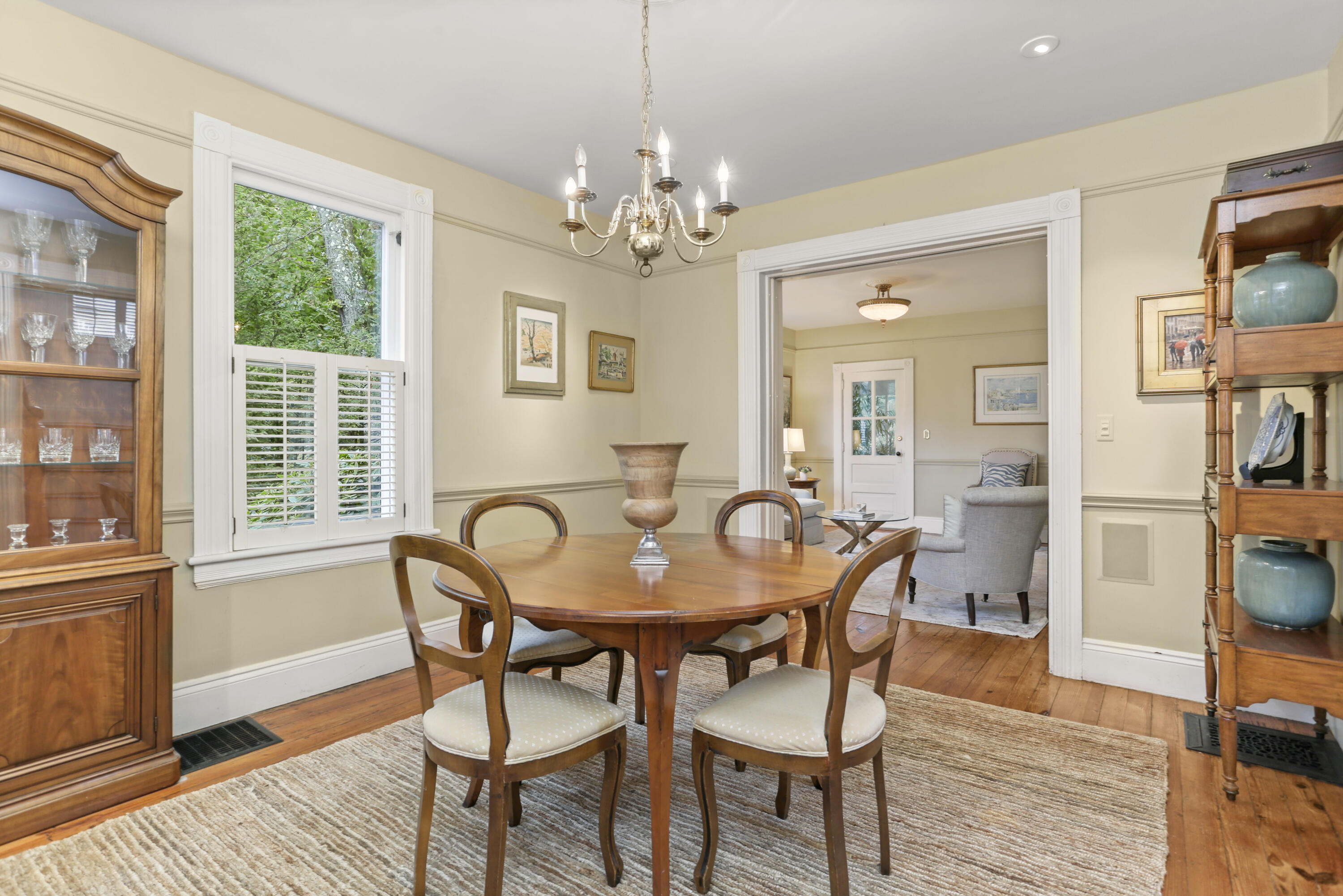 6 Park Lane Darien, CT 06820 - Photo 6 of 34 a dining room with furniture a chandelier and wooden floor