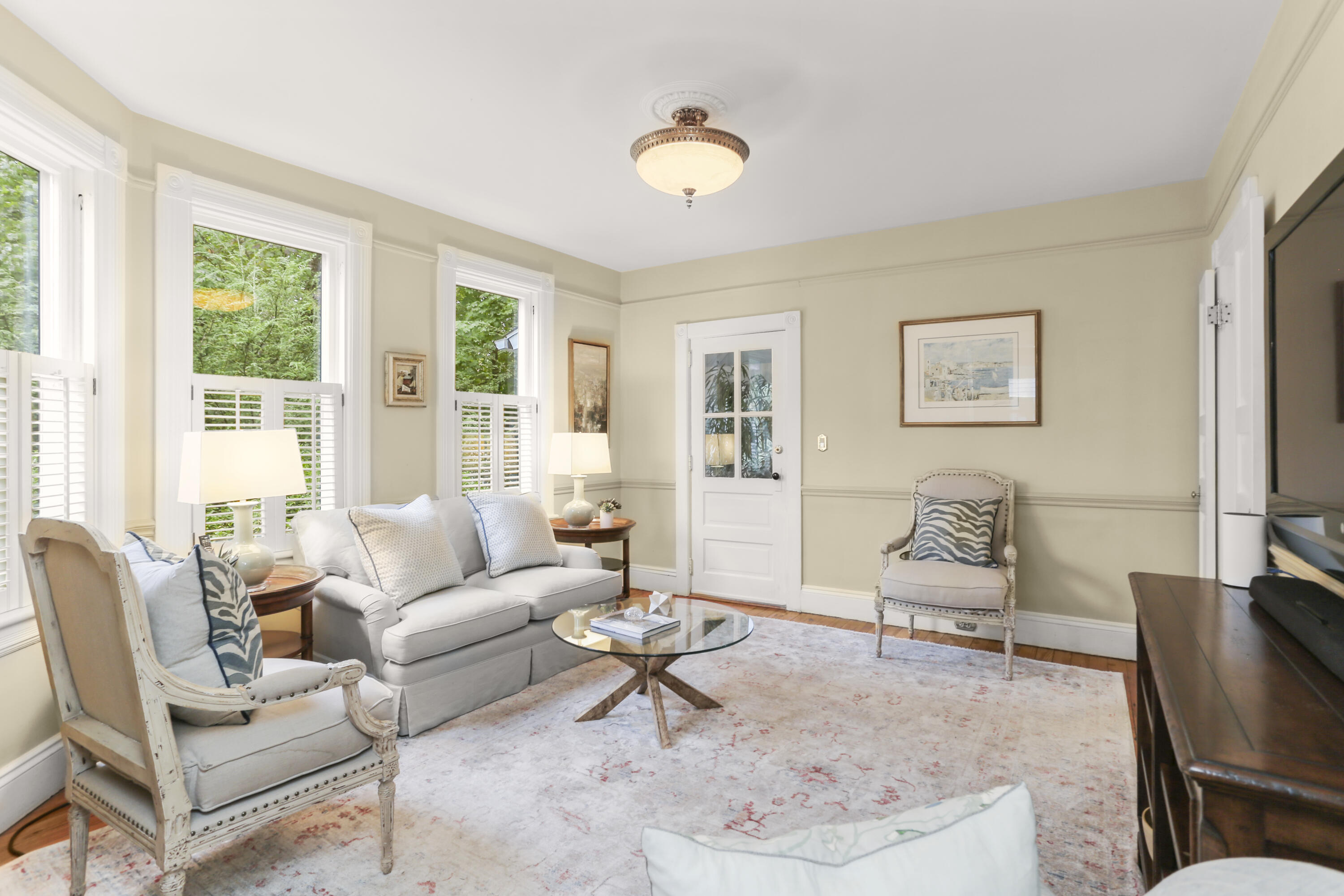 6 Park Lane Darien, CT 06820 - Photo 8 of 34 a living room with furniture and a flat screen tv with wooden floor