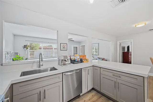 a kitchen with sink and window